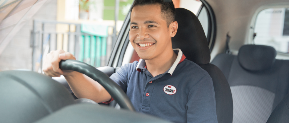 Happy Driver Wearing a Drivecard Polo Shirt
